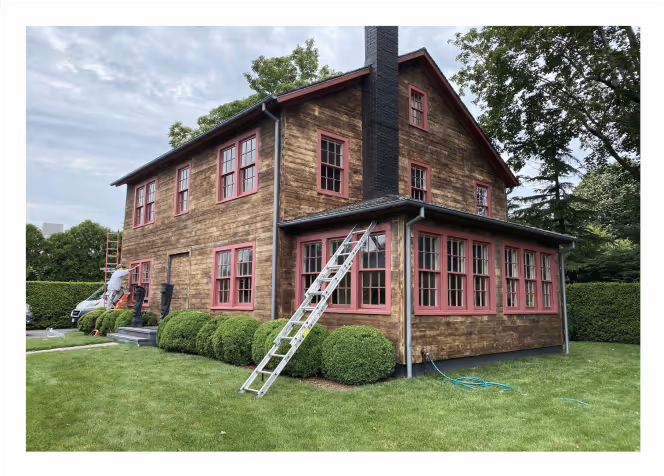 Historic wooden home before exterior painting – weathered wood siding and old window frames awaiting restoration in Long Island